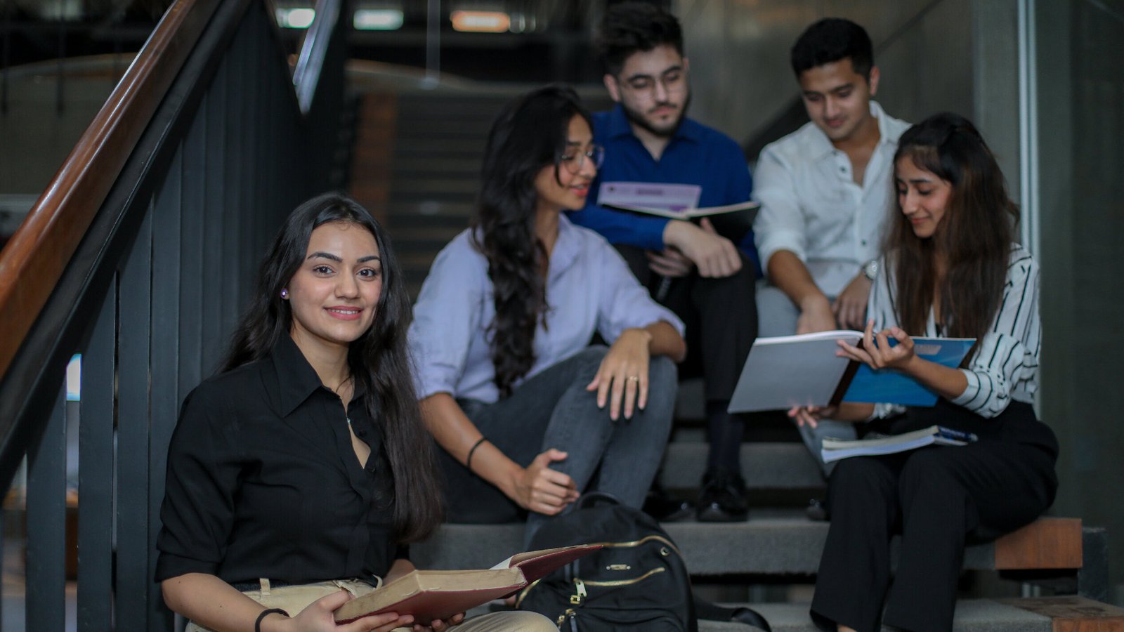 Students studying together on the campus staircase